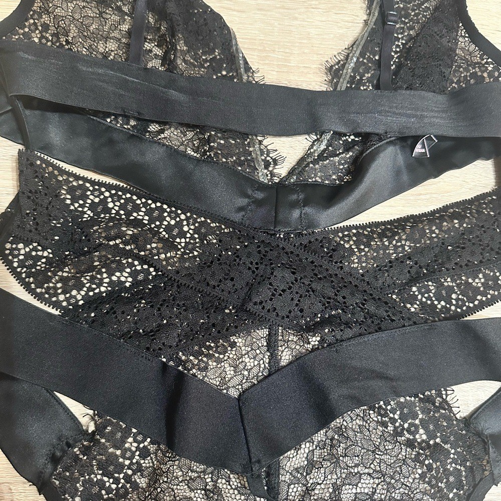 Victorias Secret Black Lace Thong Bodysuit. Size large.