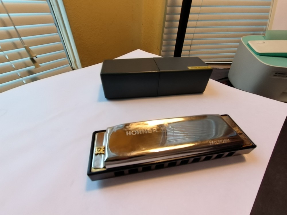 Used HARMONICA SAYS HOHNER ON IT WITH CASE