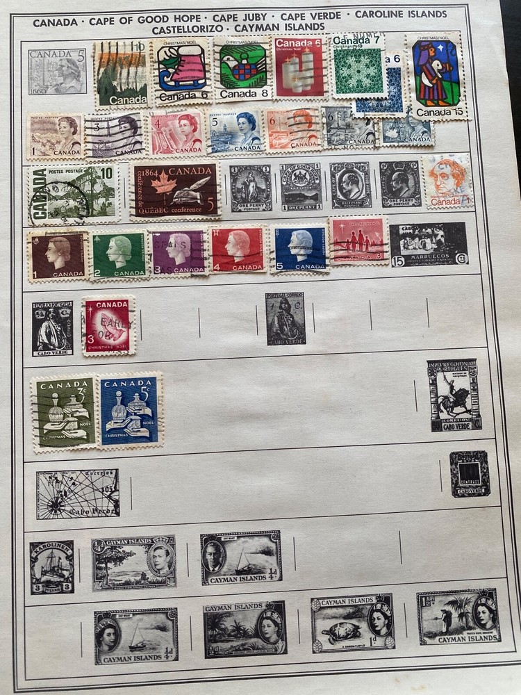 Worldwide Canada Stamps hinged on pages