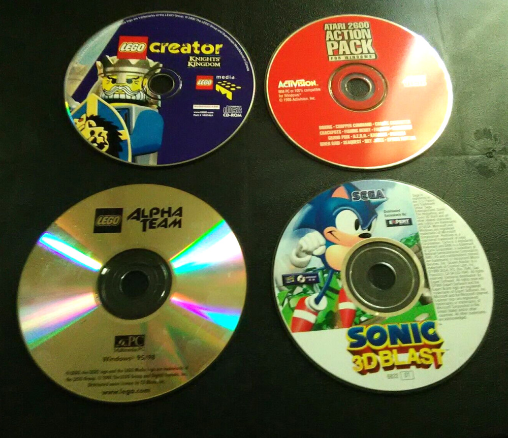 4 -PC game discs, windows. Lego Creator, Sonic 3D Blast, Atari 2600 Action pack.