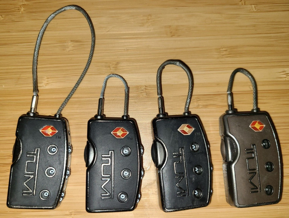 TUMI Combination Locks. Four Pieces.