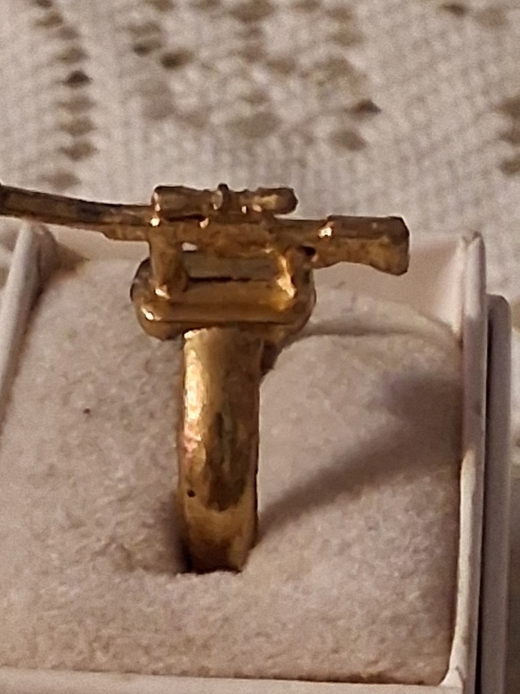 Early 40's to late 50's gold gun ring. Military based