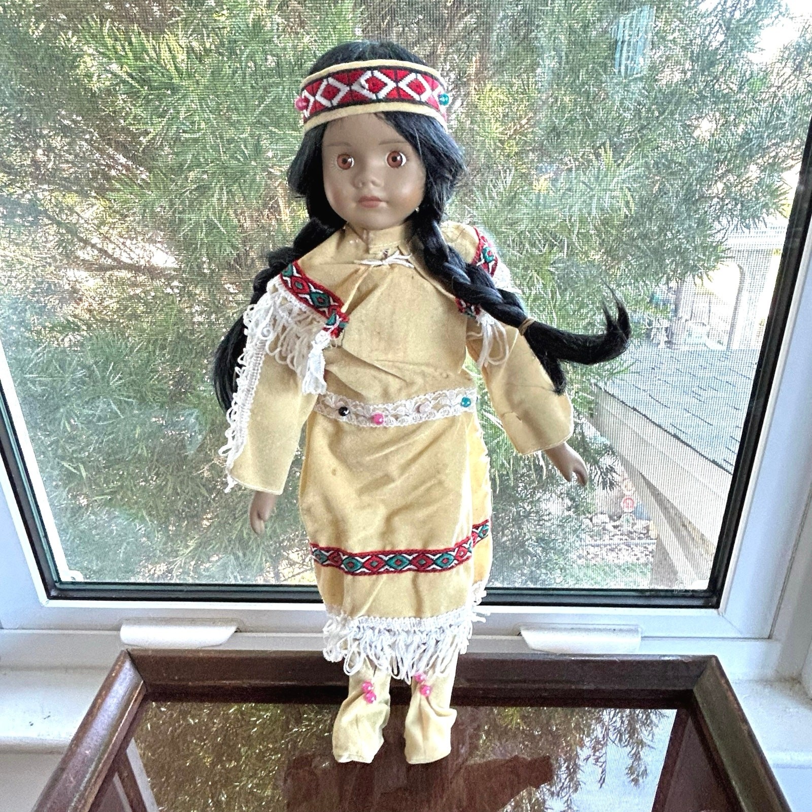 Vintage Porcelain Native American-Inspired Doll with Braids and Beaded Outfit