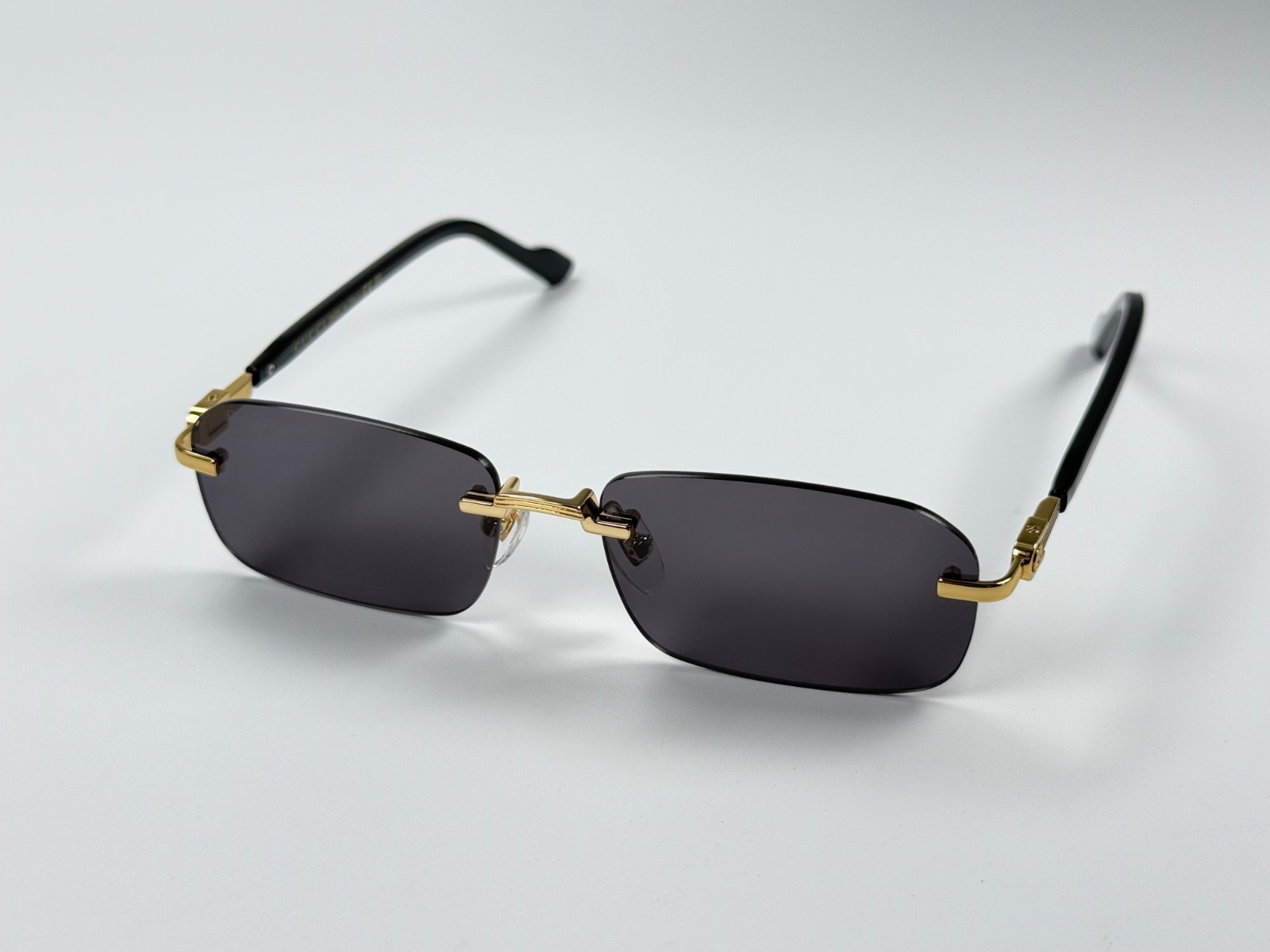 Gucci GG1221S 001 Black Gold Rimless Sunglasses Gray Lens 56mm