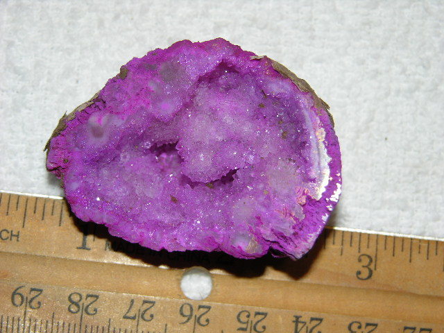 Geode cut & polished half with colored crystal center 2 inch E16