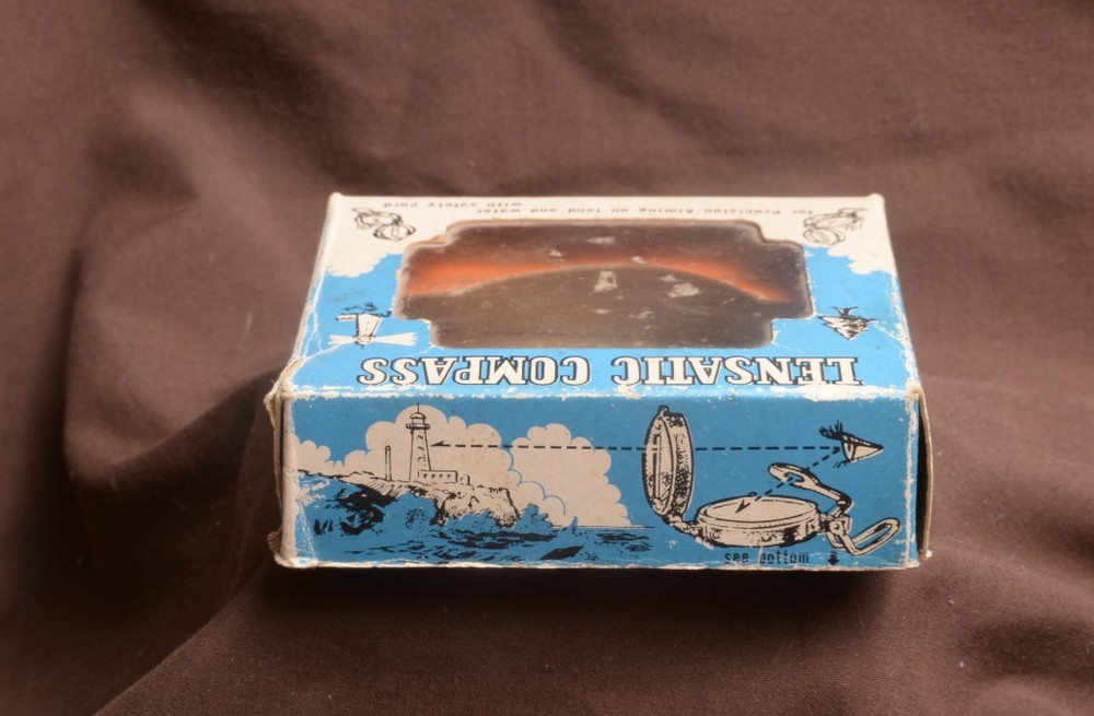 two lensatic compasses one with box