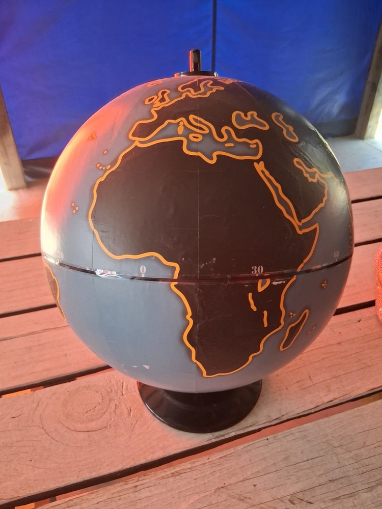 This item is a decorative desk globe, specifically a model featuring a distinct