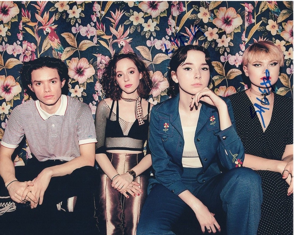 THE REGRETTES GROUP SIGNED 8X10 FLORAL BACKGROUND