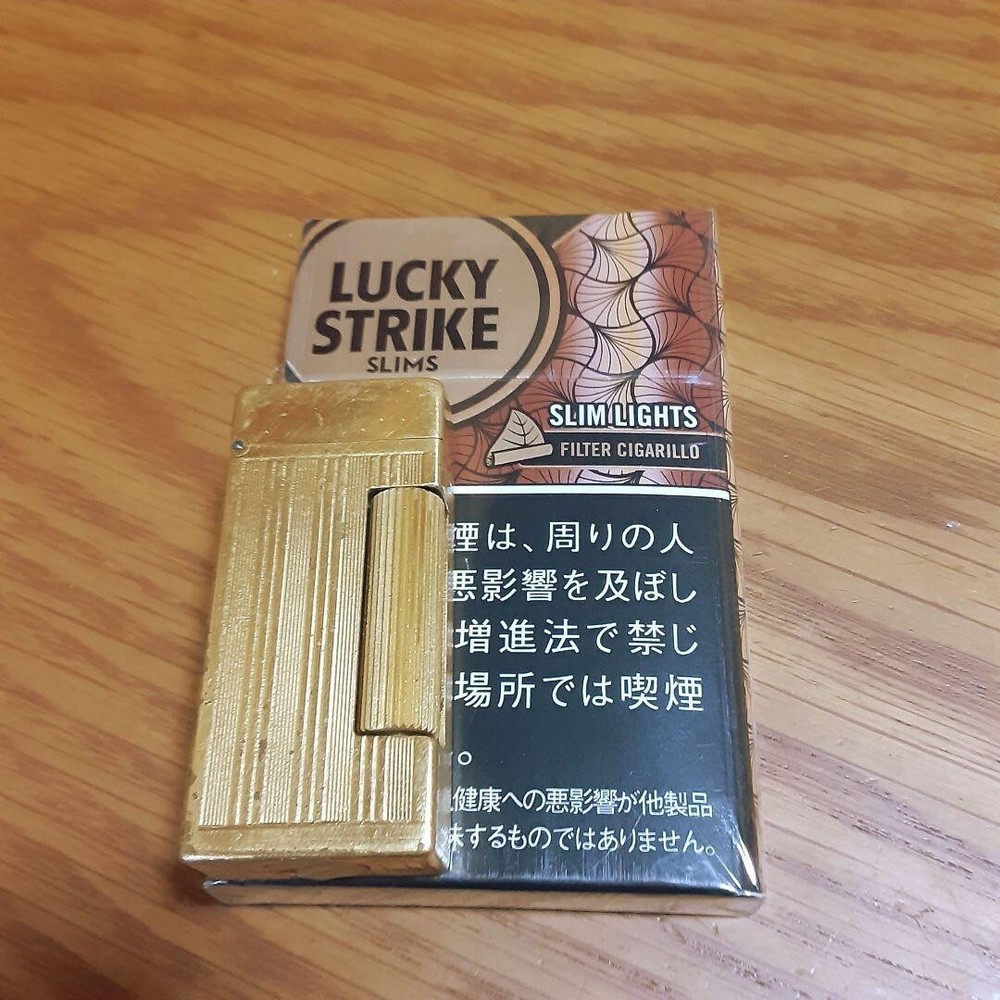 Working dunhill oil lighter gold short auto roller without box