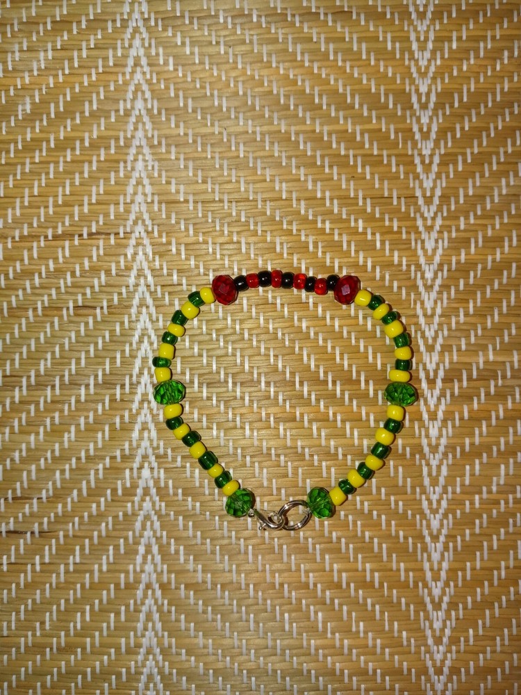 IDDE DE MANO O KOFA DE ORULA CON ELEGUA DE CRISTAL
