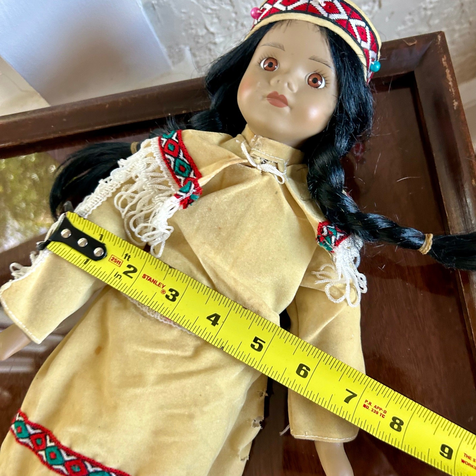 Vintage Porcelain Native American-Inspired Doll with Braids and Beaded Outfit