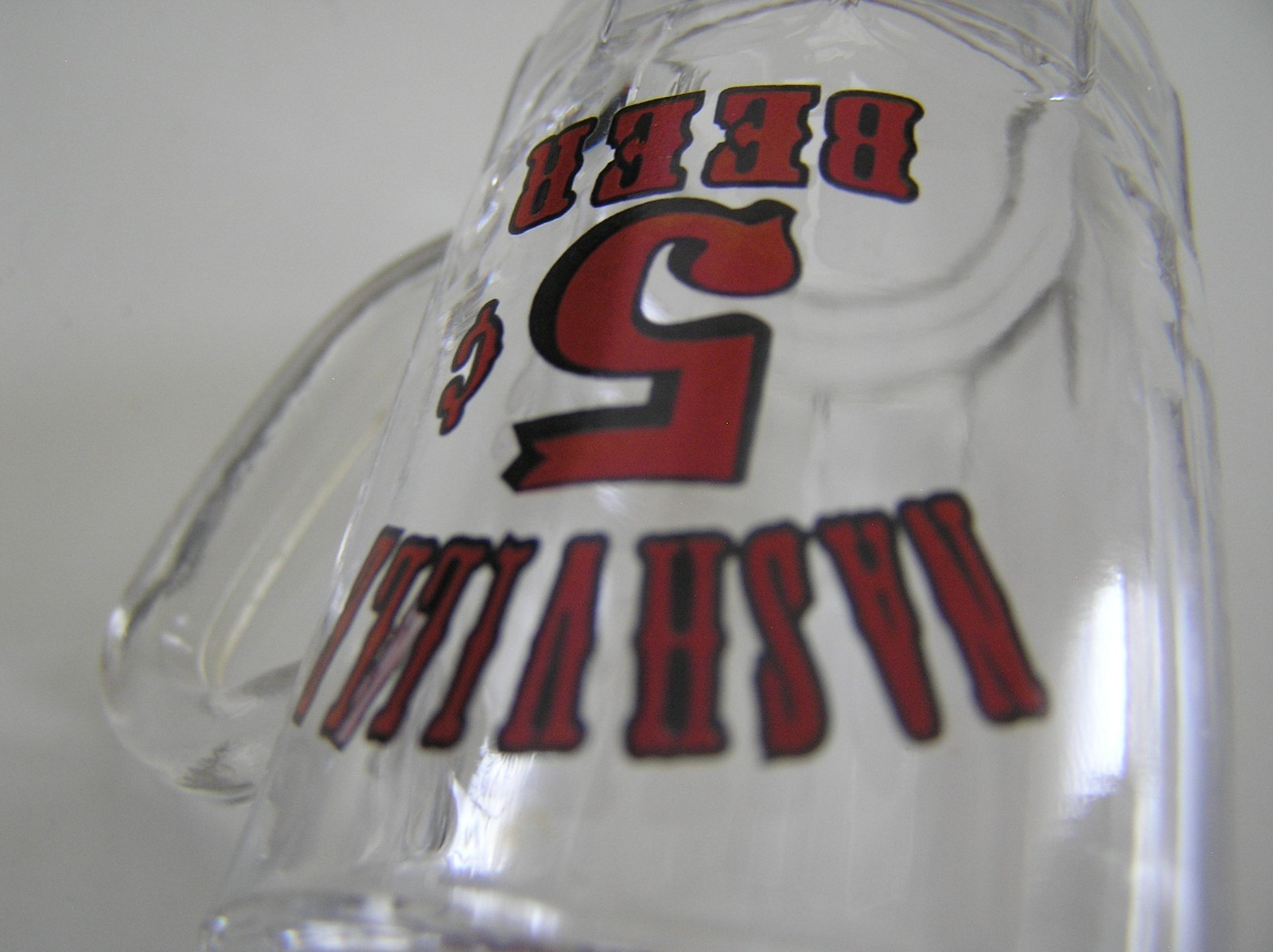 2 Souvenirs Shot Mugs: A Black Rumple Minze and A Clear Nashville 5cents Beer