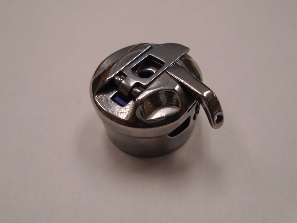 S15902-201 SEWING MACHINE BOBBIN CASE A603
