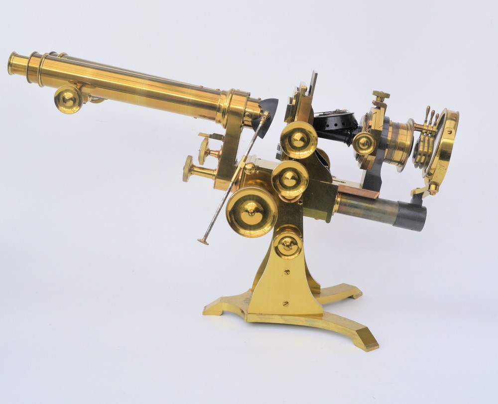 Very large binocular microscope in case with accessories.