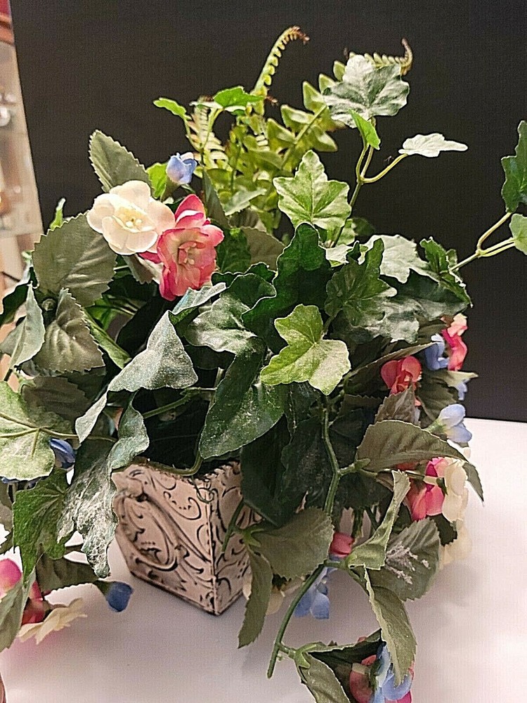 CREAM TIN RECTANGULAR PLANTER WITH HANDLES FILLED WITH FLOWERS