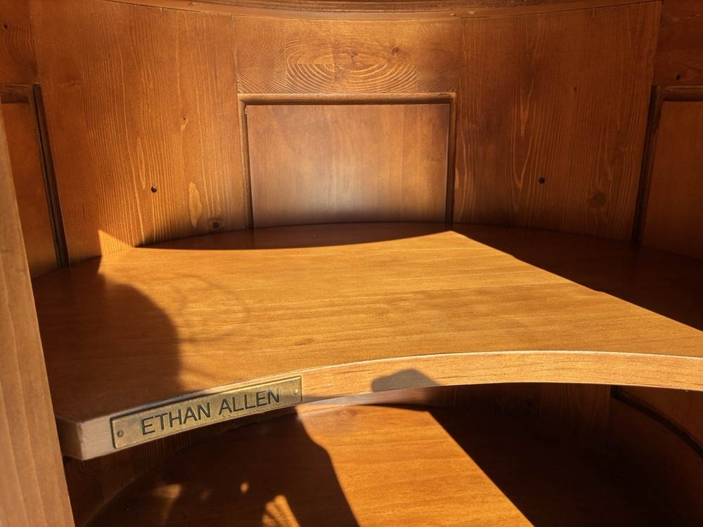 This Ethan Allen Tuscan Oval Cabinet Drum Table