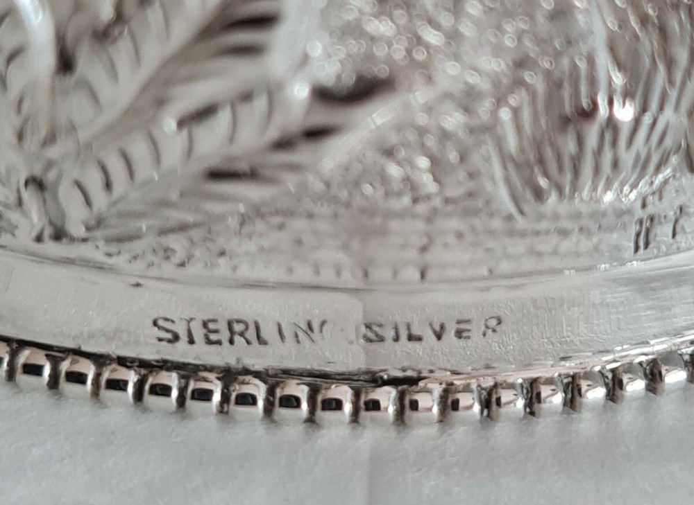 Antique oriental Napkin ring . Marked Sterling silver.