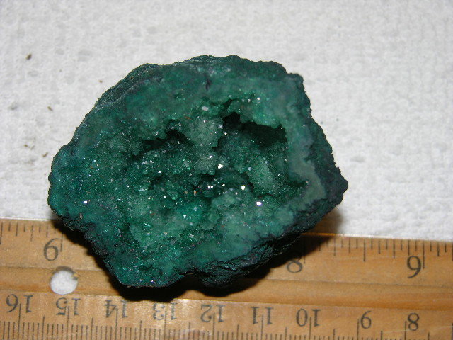 Geode cut & polished half with colored crystal center 2 inch E23