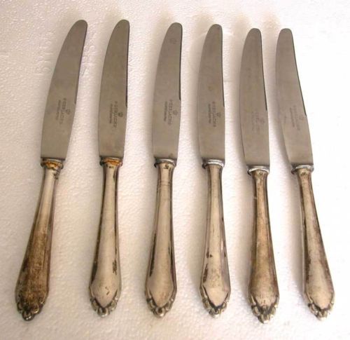 A FINE SET OF 6 SOLID SILVER GERMAN KNIVES