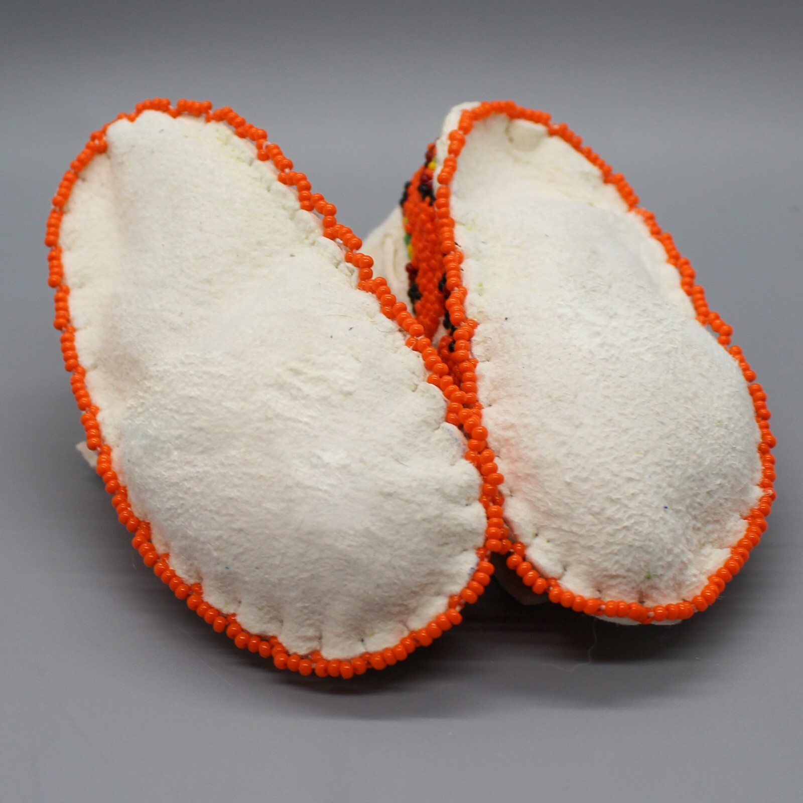 CHEYENNE-FULLY BEADED WHITE LEATHER BABY MOCCASINS by JANET WHITEMAN