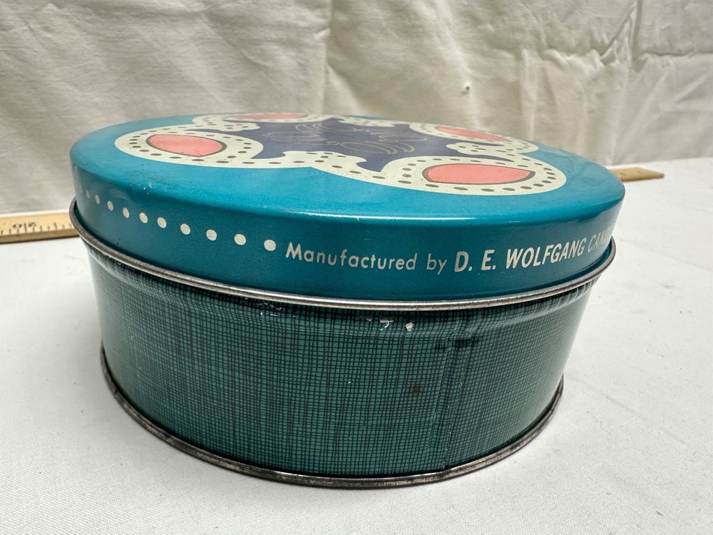 D. E. Wolfgang Candy Tin - 6 inch round