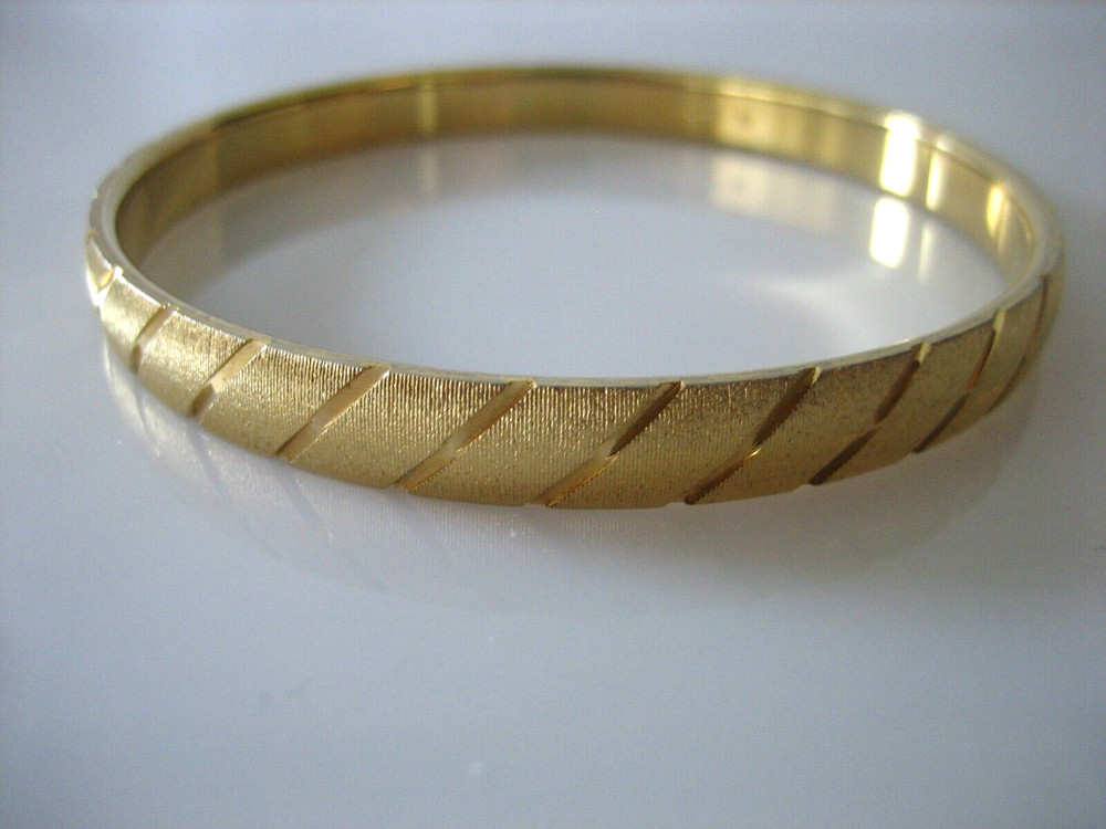 MONET SIGNED GOLD TONE TEXTURED AND SMOOTH BANGLE BRACELET