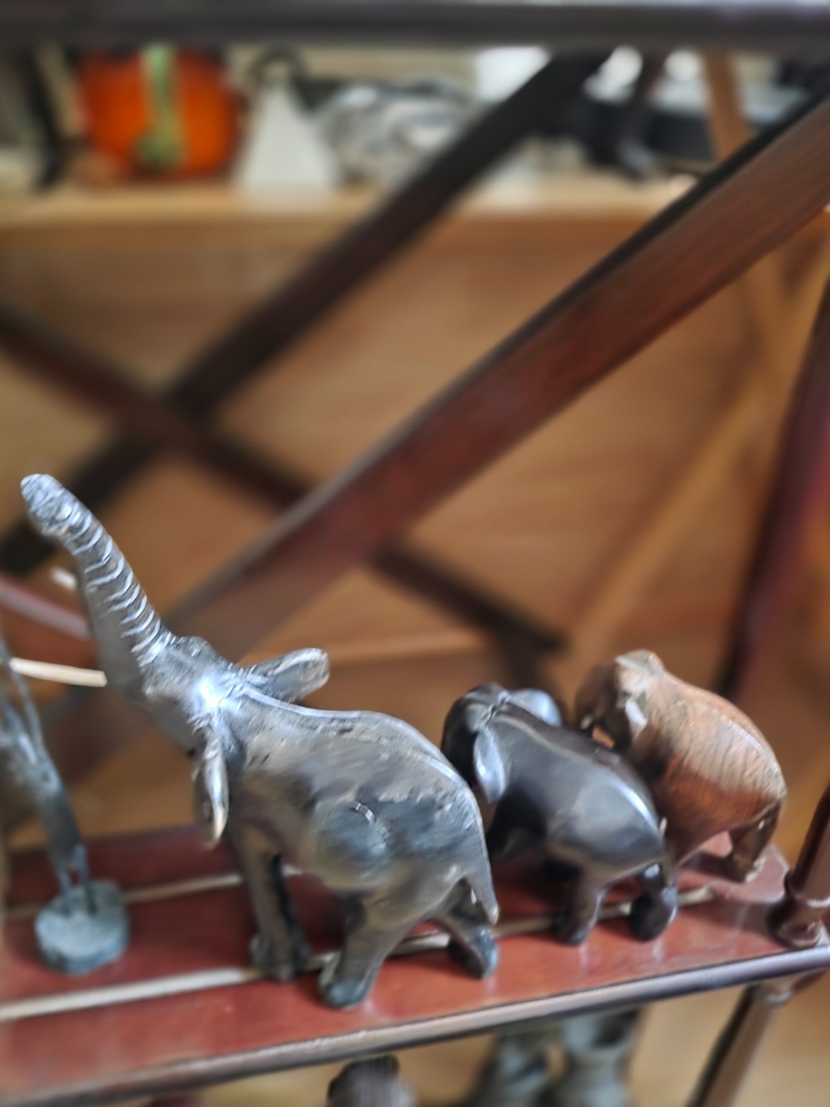 Set of carved statues from black wood, stone, bronze.