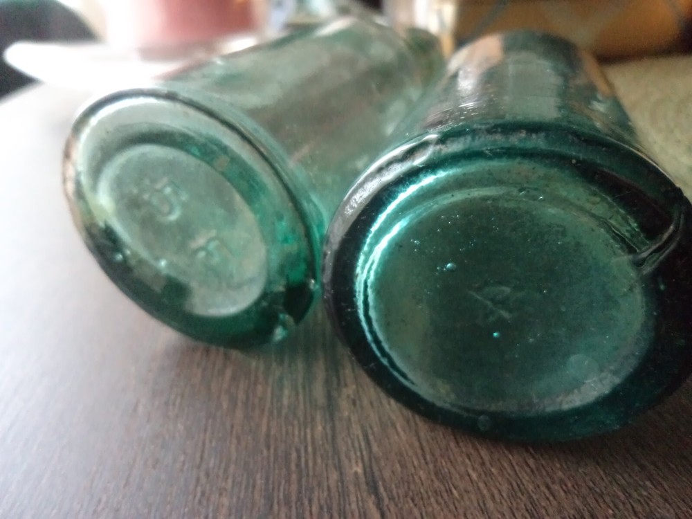 2 x antique aqua coloured bottles