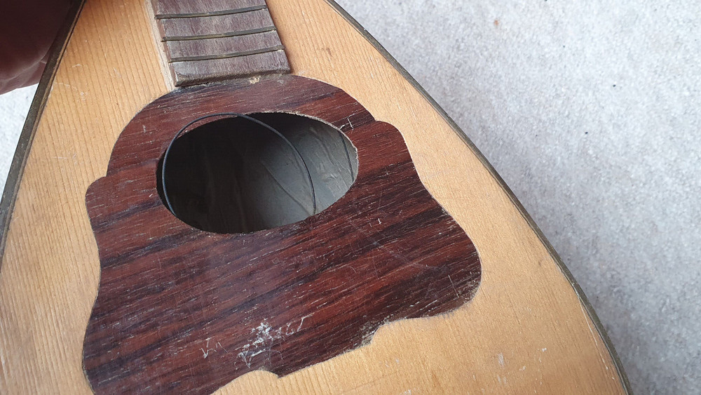 old mandolin, needs repair