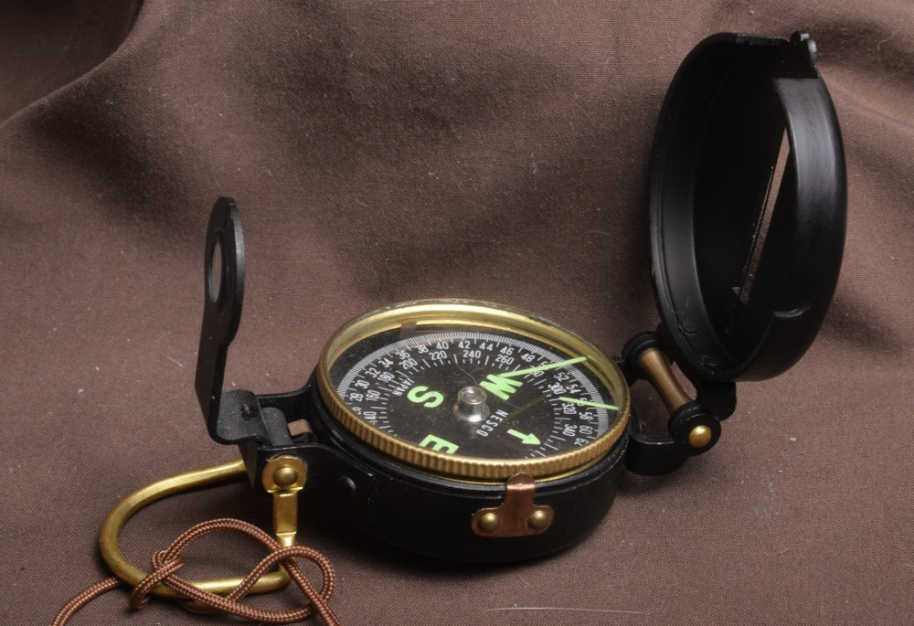 two lensatic compasses one with box