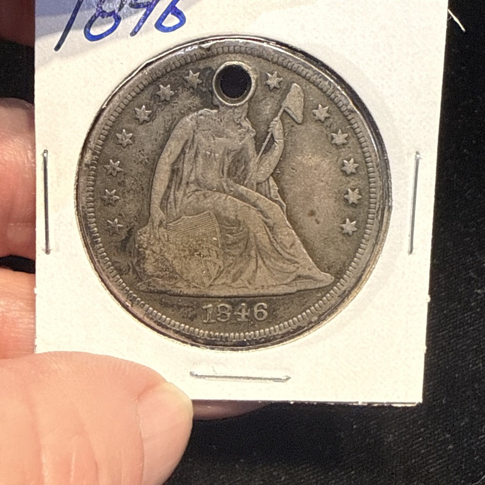 1846 Seated Liberty Dollar Holed.