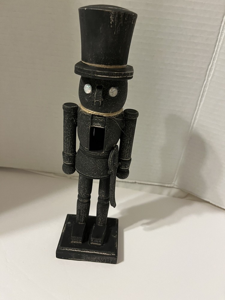 Black washed wooden folk art nutcracker
