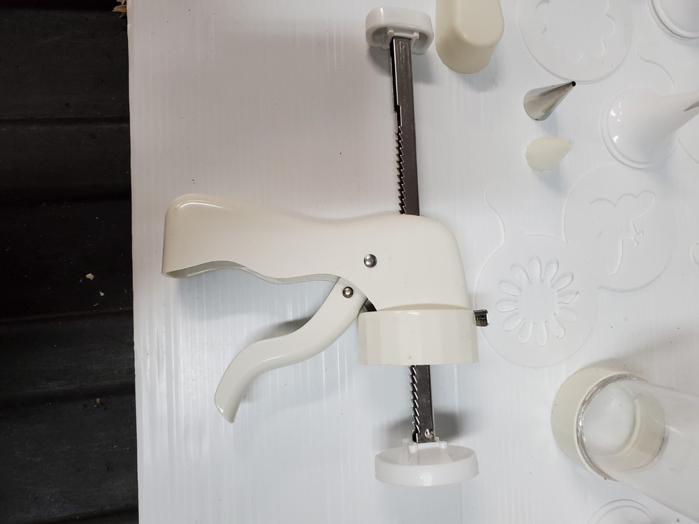 White plastic Cookie Press Disc Cutouts -with extras