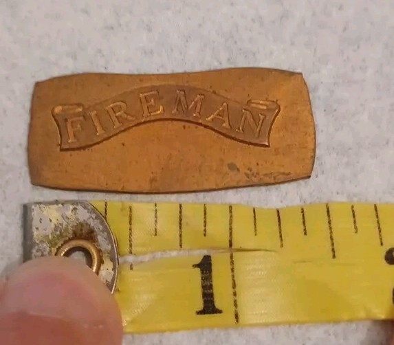 vintage Fireman Brass Stamping With Flat Back