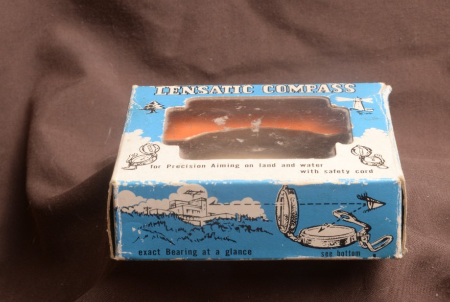 two lensatic compasses one with box