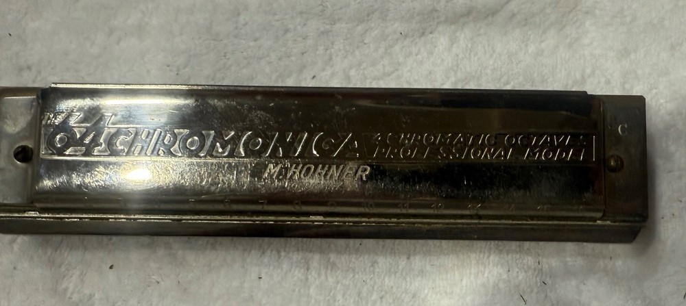 Hohner "The 64 Chromonica" professional model chromatic harmonica. Here's more
