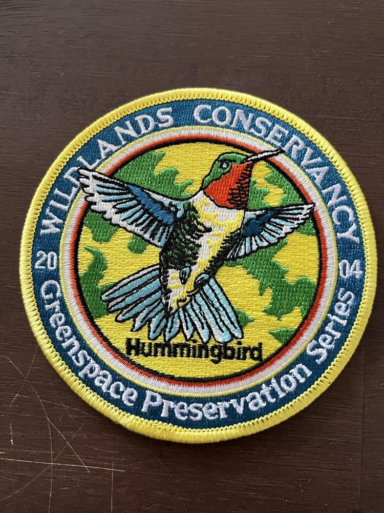 2004 WILDLANDS CONSERVANCY PATCH 4" DIA “HUMMINGBIRD”