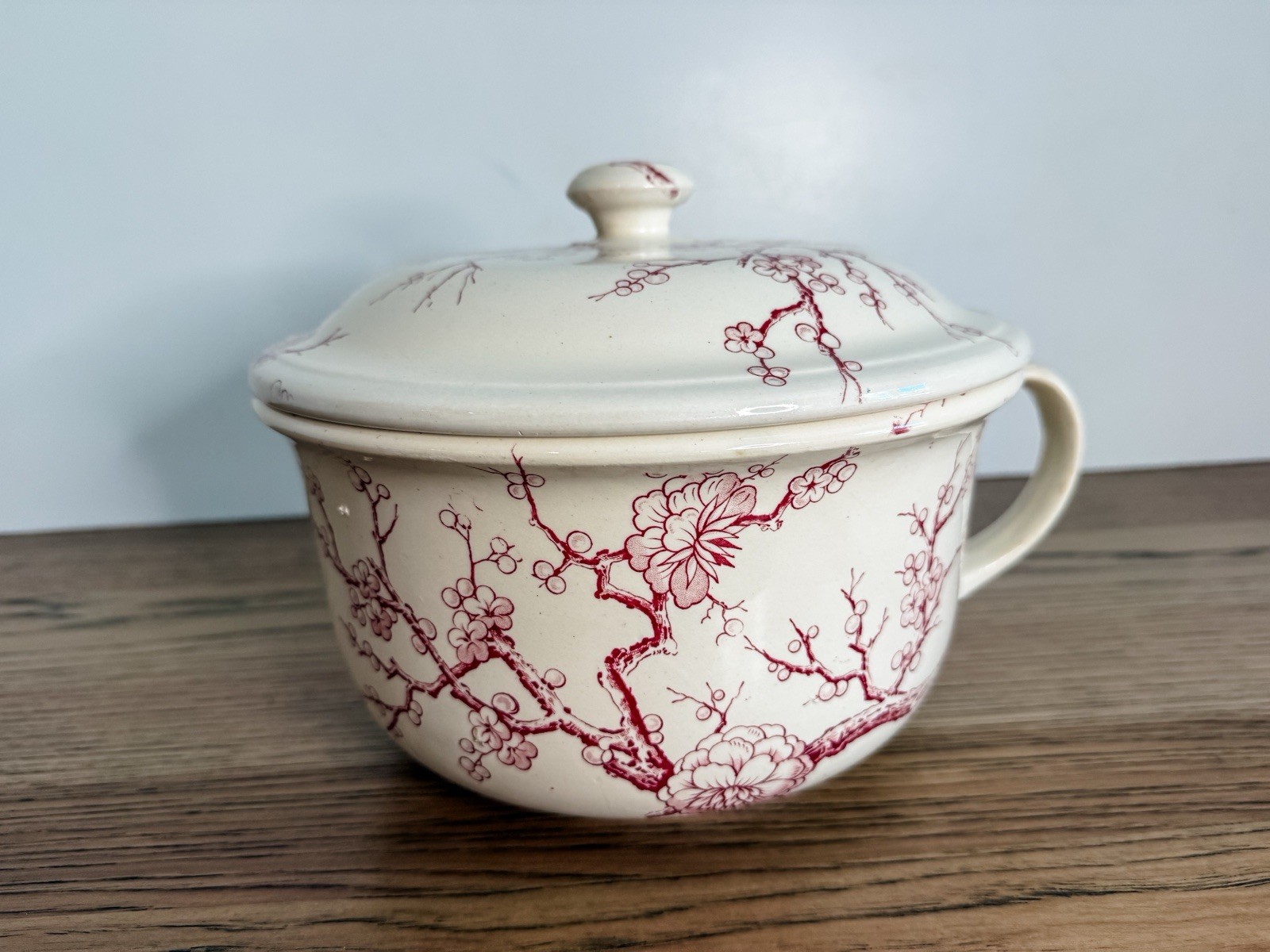 Antique Chamber Pot With A Red  Transferware Pattern