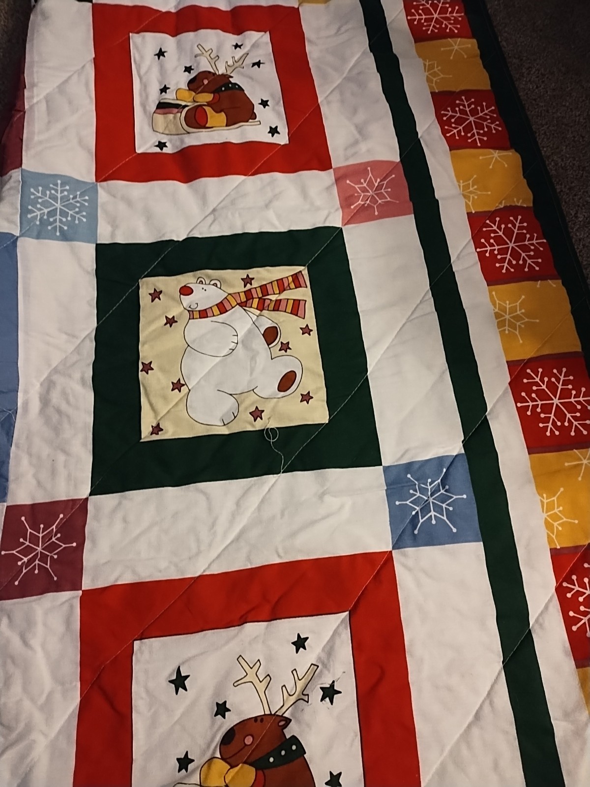 quilt featuring a winter scene with a snowman, reindeer, and penguin Q/F