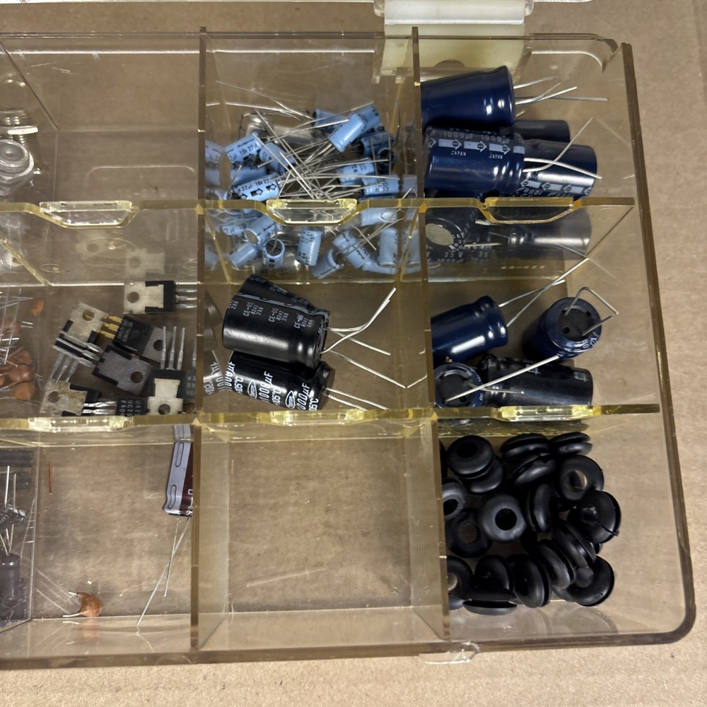 assorted electronics components, parts in a compartment box, NOS capacitors, etc