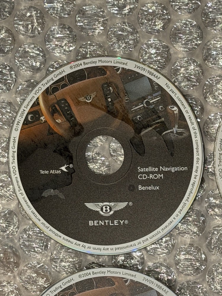 2004 Bentley Continental GT 7 Navigation Disc Set & Bentley Disc Case.