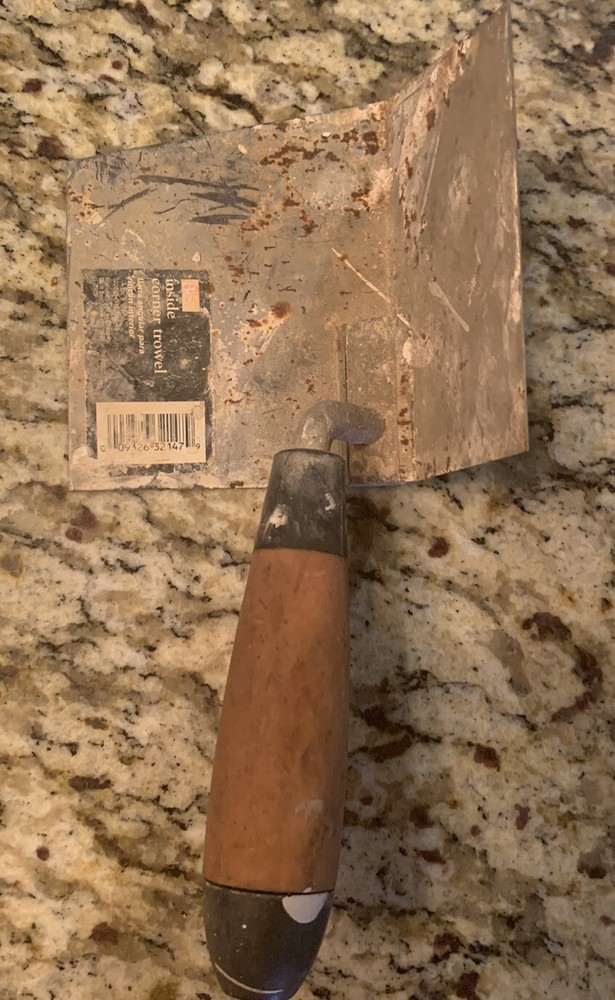 inside corner trowel 5” x 4” with wood handle