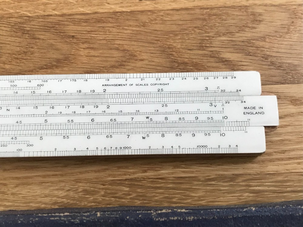 nice old good looking unique electrical slide rule in case