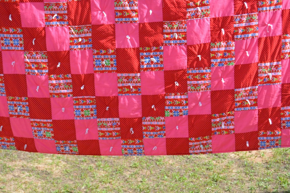 Homemade pink/red tied method patchwork quilt 57x82"
