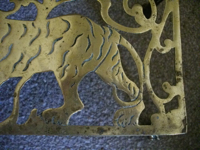 Brass trivet stand with strolling Tiger c1880
