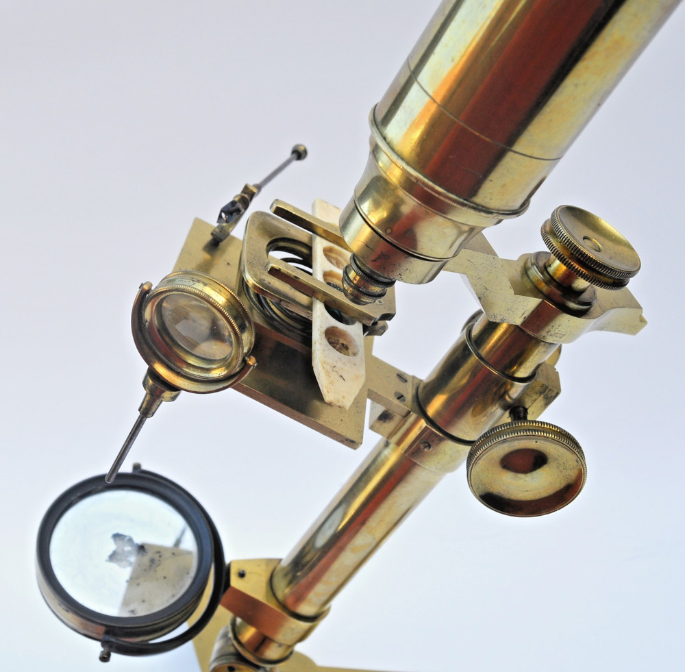 Brass microscope in case.