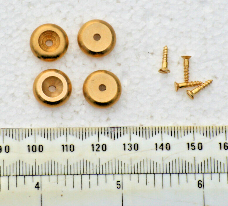 A SET OF 4 STYLISH CAST BRASS BUN STYLE CLOCK FEET.