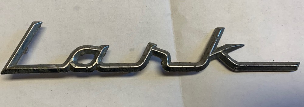 VINTAGE STUDEBAKER LARK METAL EMBLEM Read