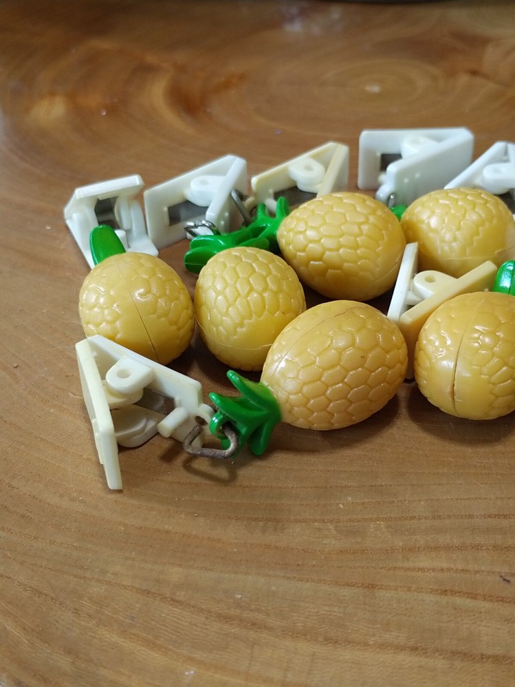 10 plastic pineapple shaped tablecloth weights. picnics, outdoor dining