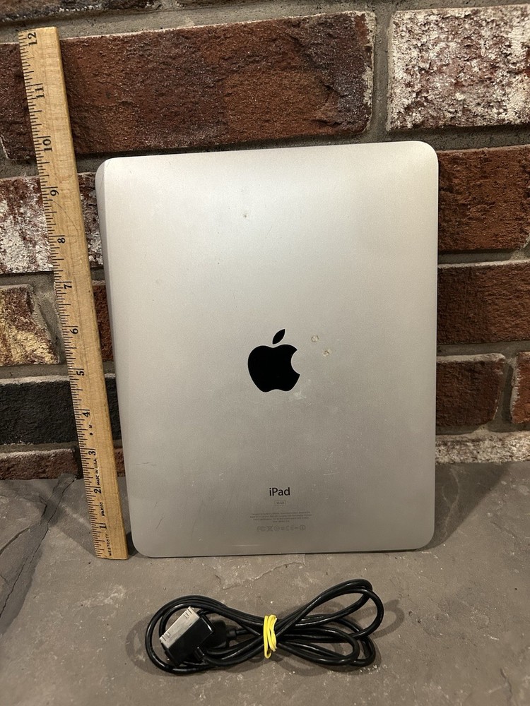 first-generation Apple iPad with a 30-pin charging cable